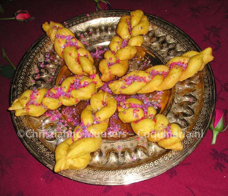 The deep-fried braids are sprinkled with coloured sugar