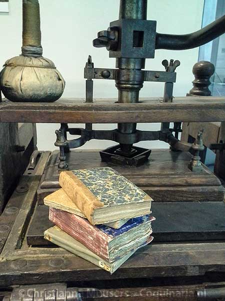 18th-century cookery books on a printing press from the same century in the Library Special Collections in Amsterdam